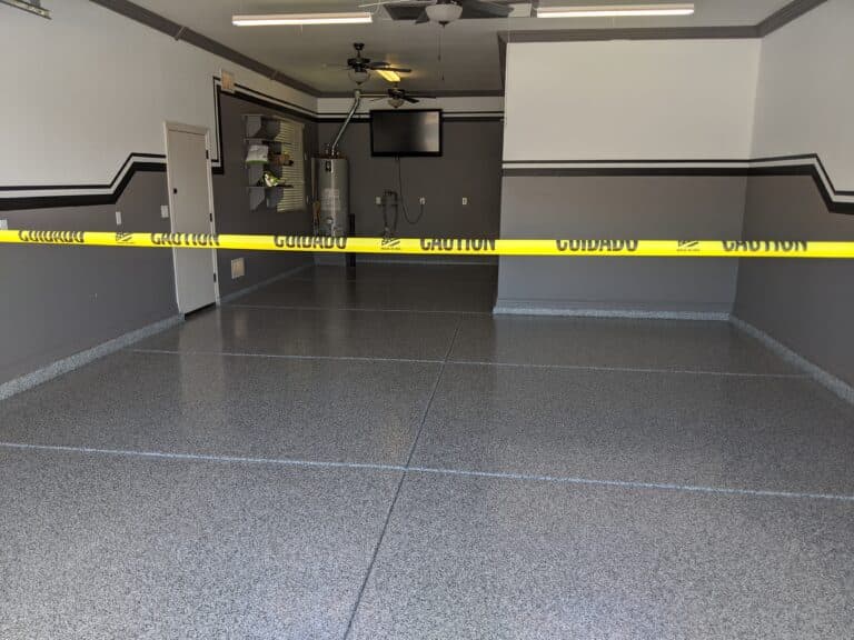 Two-car garage with gray flake epoxy floor in Queen Creek